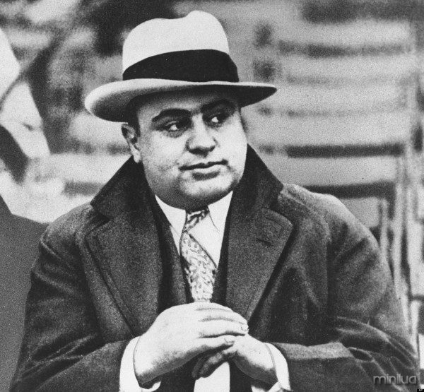 FILE - In this Jan. 19, 1931 file photo, Chicago mobster Al Capone attends a football game in Chicago. On Thursday, Feb. 14, 2013, the Chicago Crime Commission and the Drug Enforcement Administration are scheduled to name Joaquin Guzman Loera, a cartel kingpin in Mexico, as the new Public Enemy No. 1. It will the first time since Prohibition-era gangster Capone that authorities in the city deemed a crime figure so ominous a threat to deserve the label. (AP Photo/File)